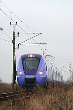 Pågatåg nr 027 (Lars-Erik Larsson) av typ X61 på premiärtur i Skåne, här i Teckomatorp den 4 december 2009