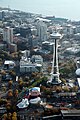 MoPOP and Space Needle seen against the backdrop of the Seattle waterfront and Puget Sound.