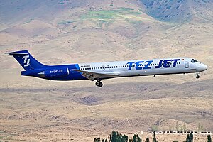 Jet airliner with two rear-mounted engines on takeoff