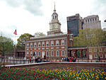 A building in red brick with a clock tower