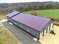 Image 6Post frame Barndominium with standing seam metal roof. Large garage on the front side and living space on the back end. (from List of house types)