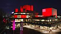 An artistic lighting scheme illuminating the exterior of the building