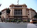 Massive, pinkish-gray building with columns