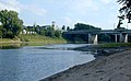 The Wabash River at Lafayette, Indiana, showing the Myers Pedestrian Bridge, and the Amtrak station. The river flows from left to right (north to south). This stretch is notable for large, sandy deposits.