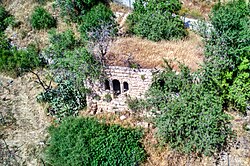 a ruined house, one of the last remains of the village