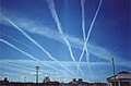 Image 39Water vapor contrails left by high-altitude jet airliners. These may contribute to cirrus cloud formation. (from Aviation)