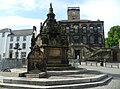 The Cross Well at Linlithgow, modelled on the courtyard fountain of Royal palace, substitutes for the town's demolished cross