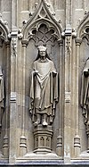 Photograph of a statue of a man wearing robes