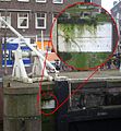 De laatst overgebleven in situ Huddesteen in de Eenhoornsluis in de Korte Prinsengracht.