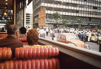 Customers at Denny's Restaurant watch May Day Demonstration-Protests. Mexico City, Mexico, May 1, 1989