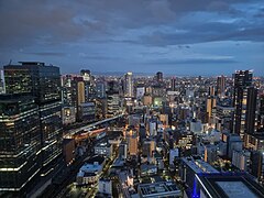 Cityscape of Osaka during the early evening.