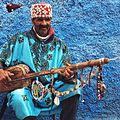 Image 47A Gnawa street performer wearing traditional Gnawi clothing in Rabat's Qasbat al-Widaya (from Culture of Morocco)