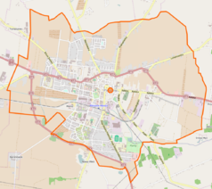 Mapa konturowa Pleszewa, blisko centrum na dole znajduje się punkt z opisem „Kościół Najświętszego Zbawicielaw Pleszewie”