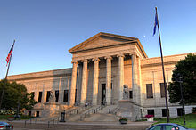 center of imposing facade of a block-long, white classical building