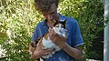 Image 14A man holding a calico cat (from Cat)