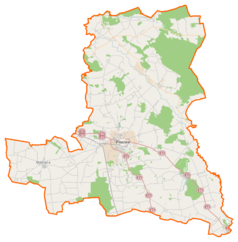 Mapa konturowa powiatu pleszewskiego, blisko centrum na dole znajduje się punkt z opisem „Kościół Najświętszego Zbawicielaw Pleszewie”