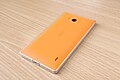 Back of an orange Nokia Lumia 930