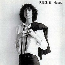 The album cover features a black-and-white photograph of Patti Smith slinging a jacket over her shoulder.