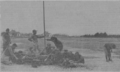 Members of the Signal Corps putting up equipment on the drill field.