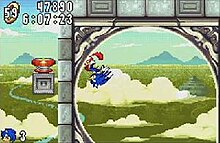 Screenshot showing Sonic running around a loop in Angel Island zone, the game's fifth level. The HUD on the upper left-hand corner shows the timer, score, and amount of rings the player has.