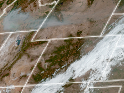 Satellite image zoomed in on Idaho, Wyoming, Utah, and Colorado. Heavy smoke, in gray, is visible over most of southern Idaho and parts of western Wyoming.