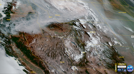 A satellite image showing heavy smoke in Oregon, Idaho, and Montana