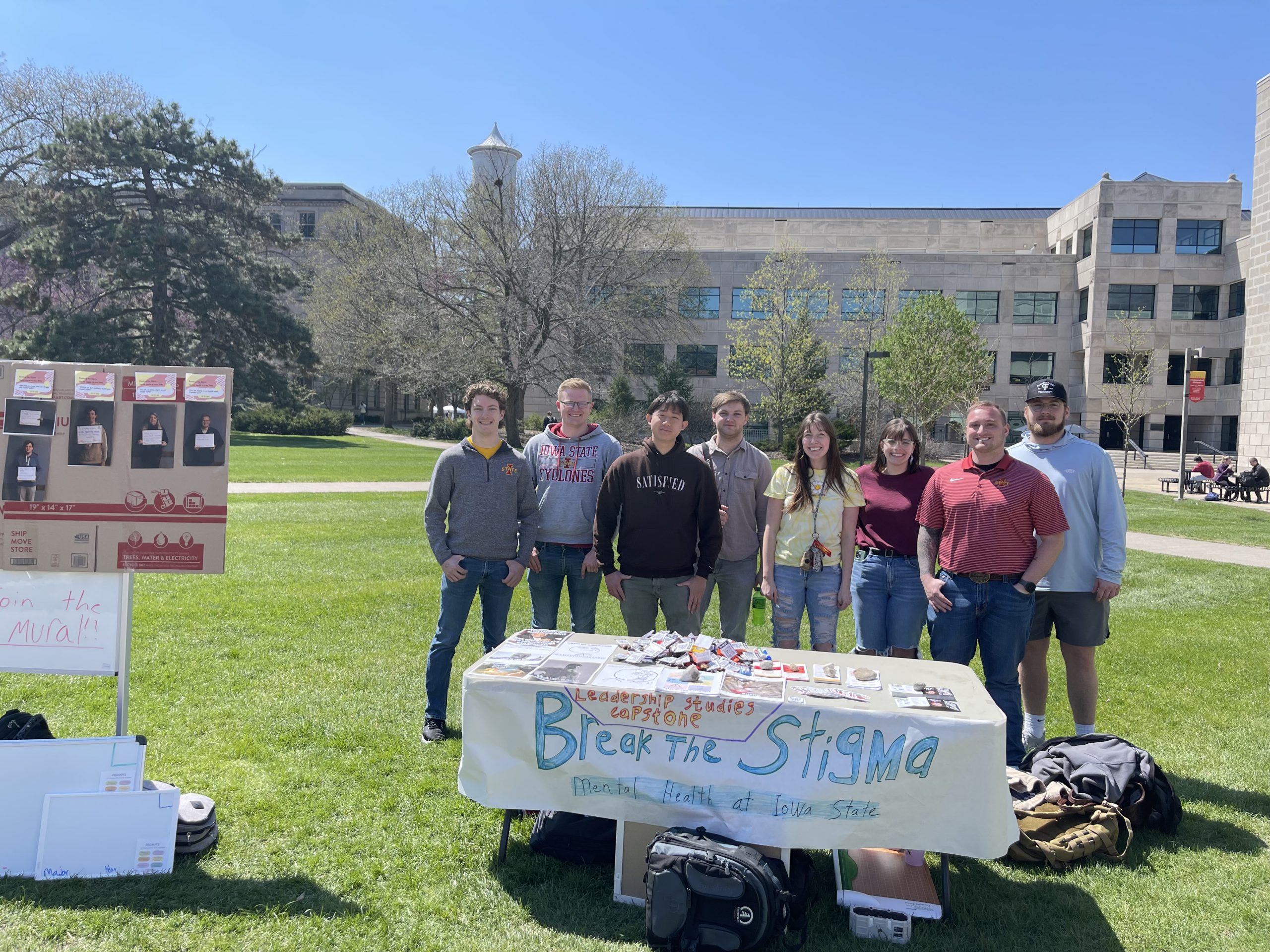 students with table on central campus