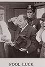 John E. Brennan, Dick Coburn, Virginia Myers, and Juanita Sponsler in Fool Luck (1913)