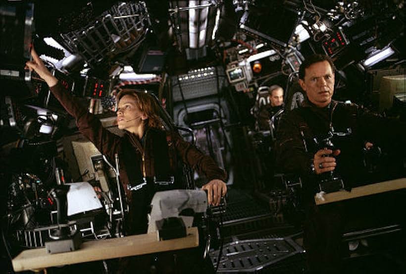 Hilary Swank and Bruce Greenwood in The Core (2003)