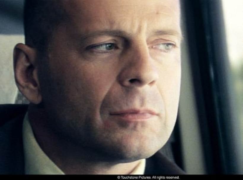 Bruce Willis, starring as David Dunn, on the train that will change his life - Photo Credit: Frank Masi. S.M.P.S.P.