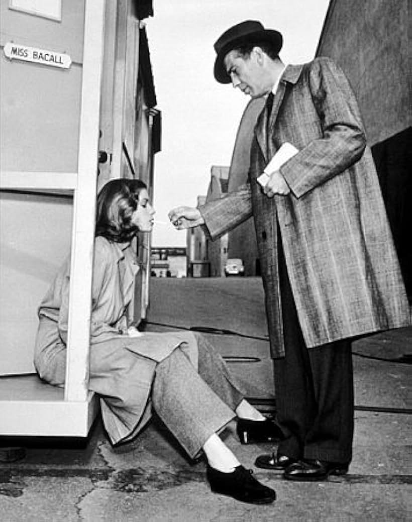 Humphrey Bogart visiting Lauren Bacall on the set of "Confidential Agent," 1945.