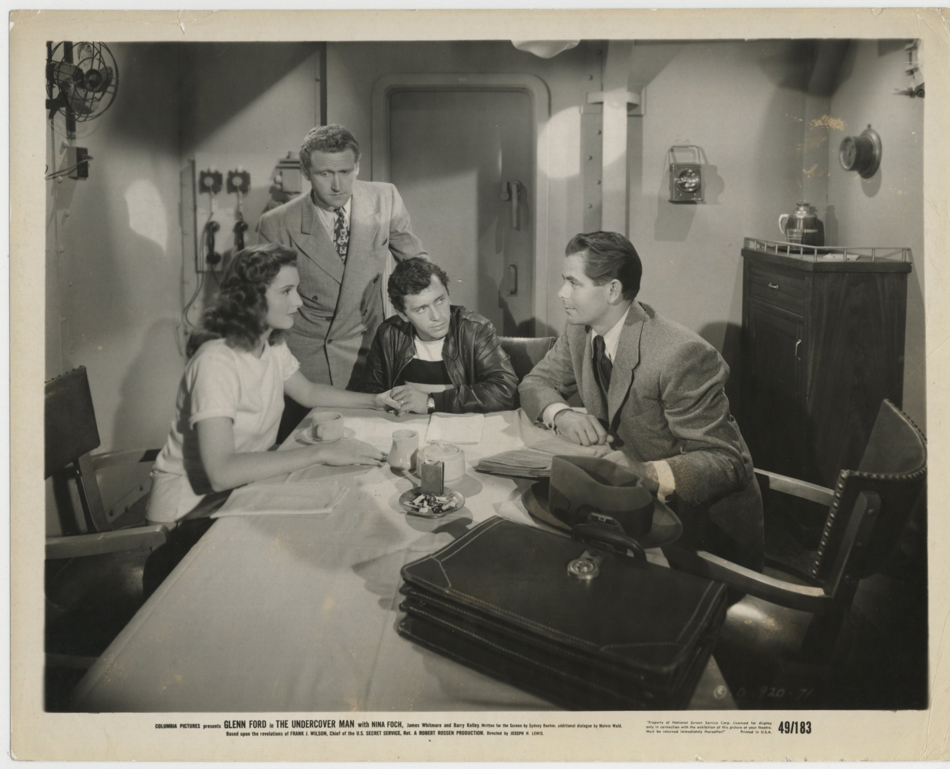 Glenn Ford, Patricia Barry, Leo Penn, and James Whitmore in The Undercover Man (1949)