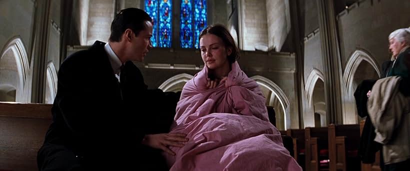 Keanu Reeves and Charlize Theron in The Devil's Advocate (1997)