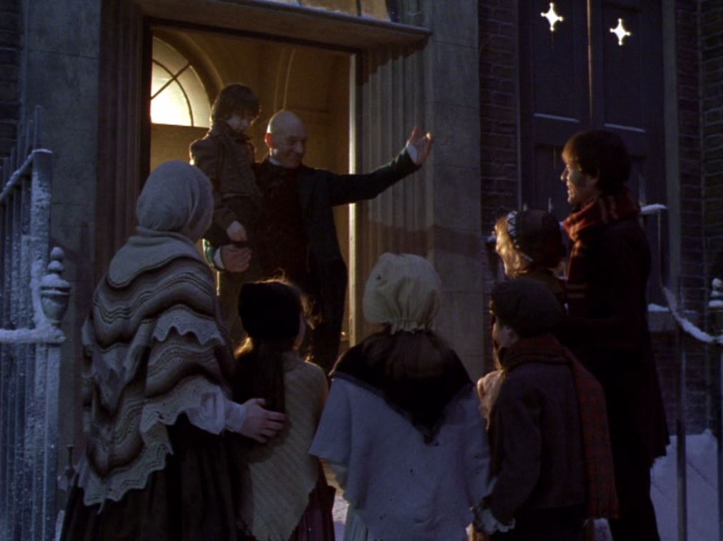 Richard E. Grant, Patrick Stewart, Saskia Reeves, and Ben Tibber in A Christmas Carol (1999)