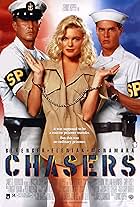 Erika Eleniak, Tom Berenger, and William McNamara in Chasers (1994)