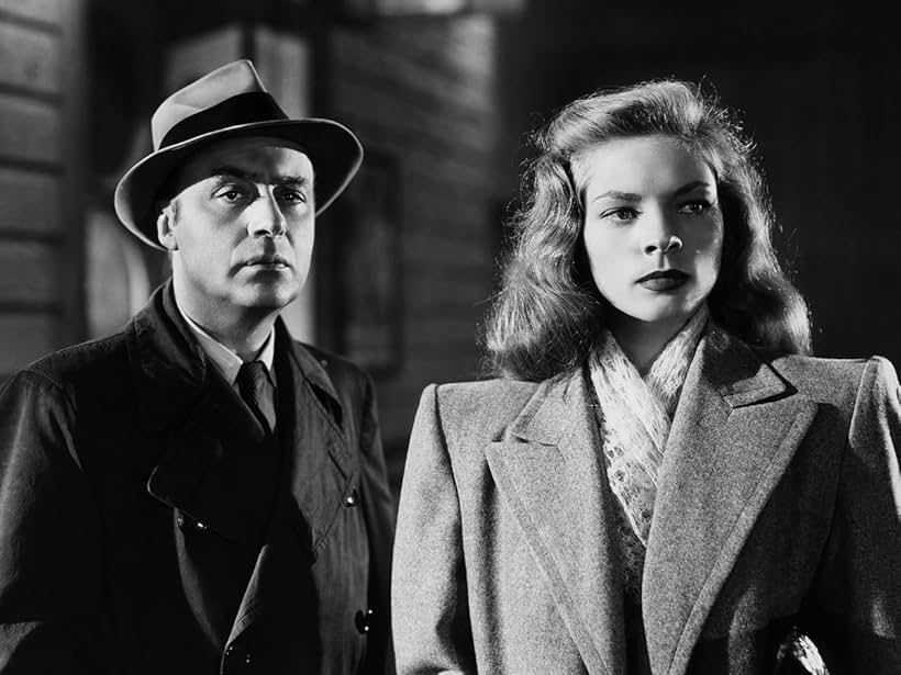 Lauren Bacall and Charles Boyer in Confidential Agent (1945)