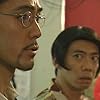 Hiroshi Abe and Katsuhisa Namase in Trick (2000)