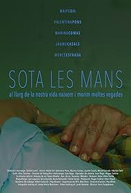 Sota les mans (2022)