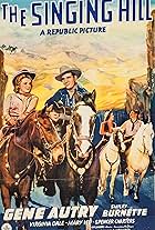 Gene Autry, Smiley Burnette, Virginia Dale, and Mary Lee in The Singing Hill (1941)