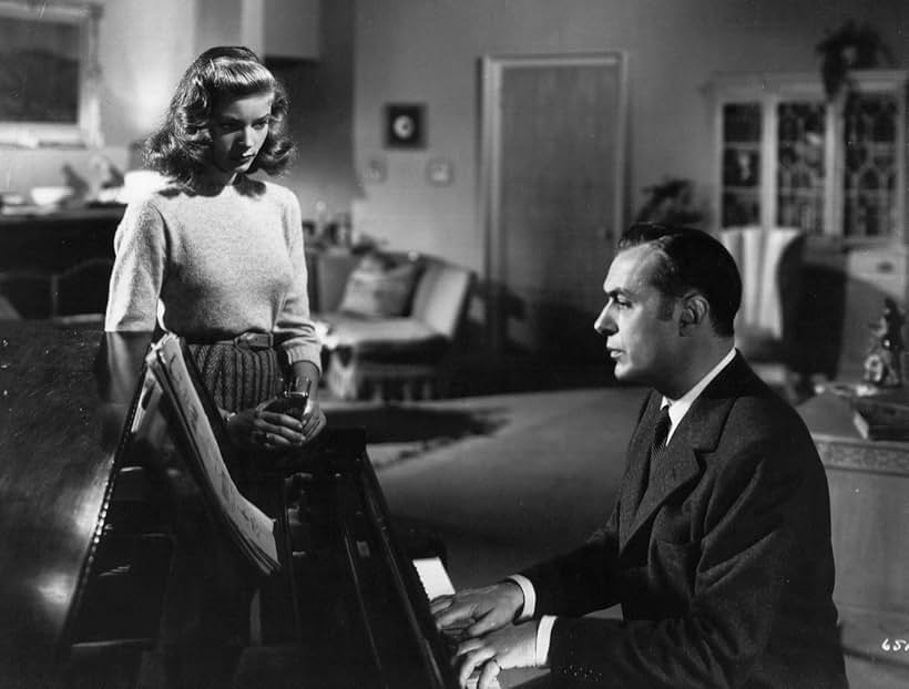 Lauren Bacall and Charles Boyer in Confidential Agent (1945)