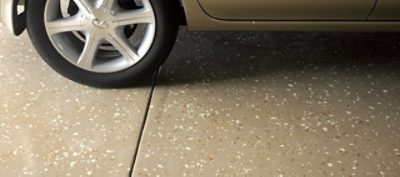 A garage with neutral colored flooring.