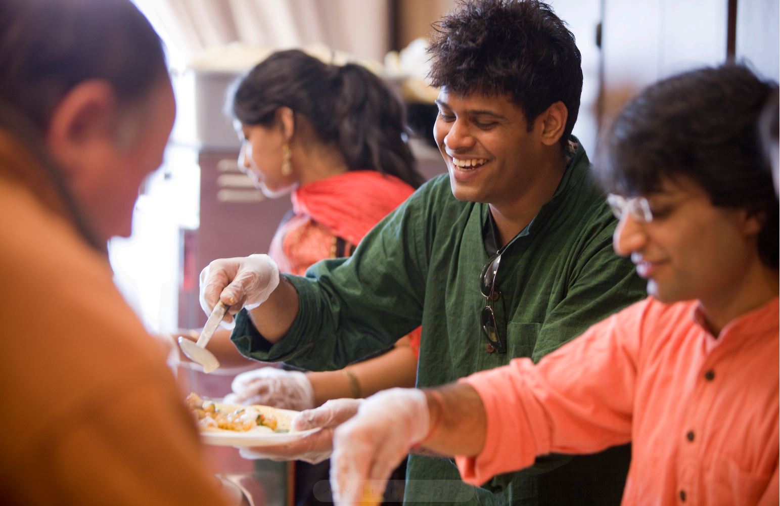 Two students serving food in the dining halls on campus