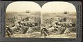 UK soldiers in trenches with tank in background, Battle of Cambrai. Original Caption:"Down in a Shell crater, We Fought Like Kilkenny Cats"