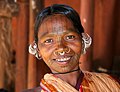 Woman with septum piercing and stretched ear lobes, India