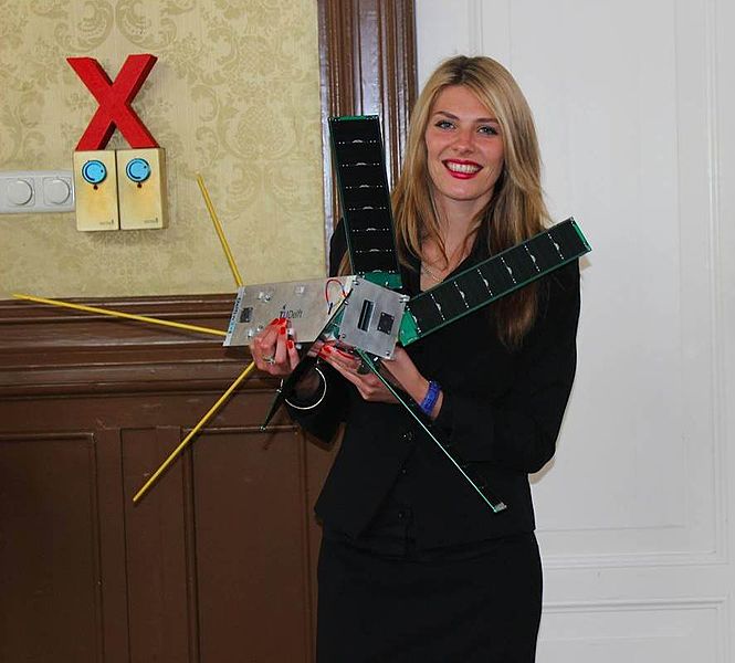 File:Fatima Dyczynski with a nanosatellite.jpg