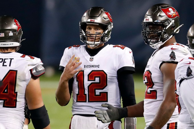 Tampa Bay Buccaneers quarterback Tom Brady (12) holds up four fingers thinking it was only fourth down after his teams final play of the game against the Chicago Bears during an NFL football game in Chicago, Thursday, Oct. 8, 2020. The Bears won the game 20-19. (Jeff Haynes/AP Images for Panini)