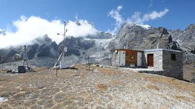 A small house on top of a mountain.