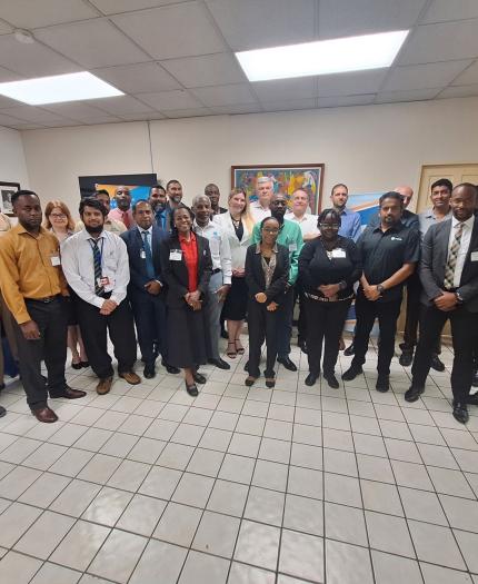 A group of people posing for a picture in an office.