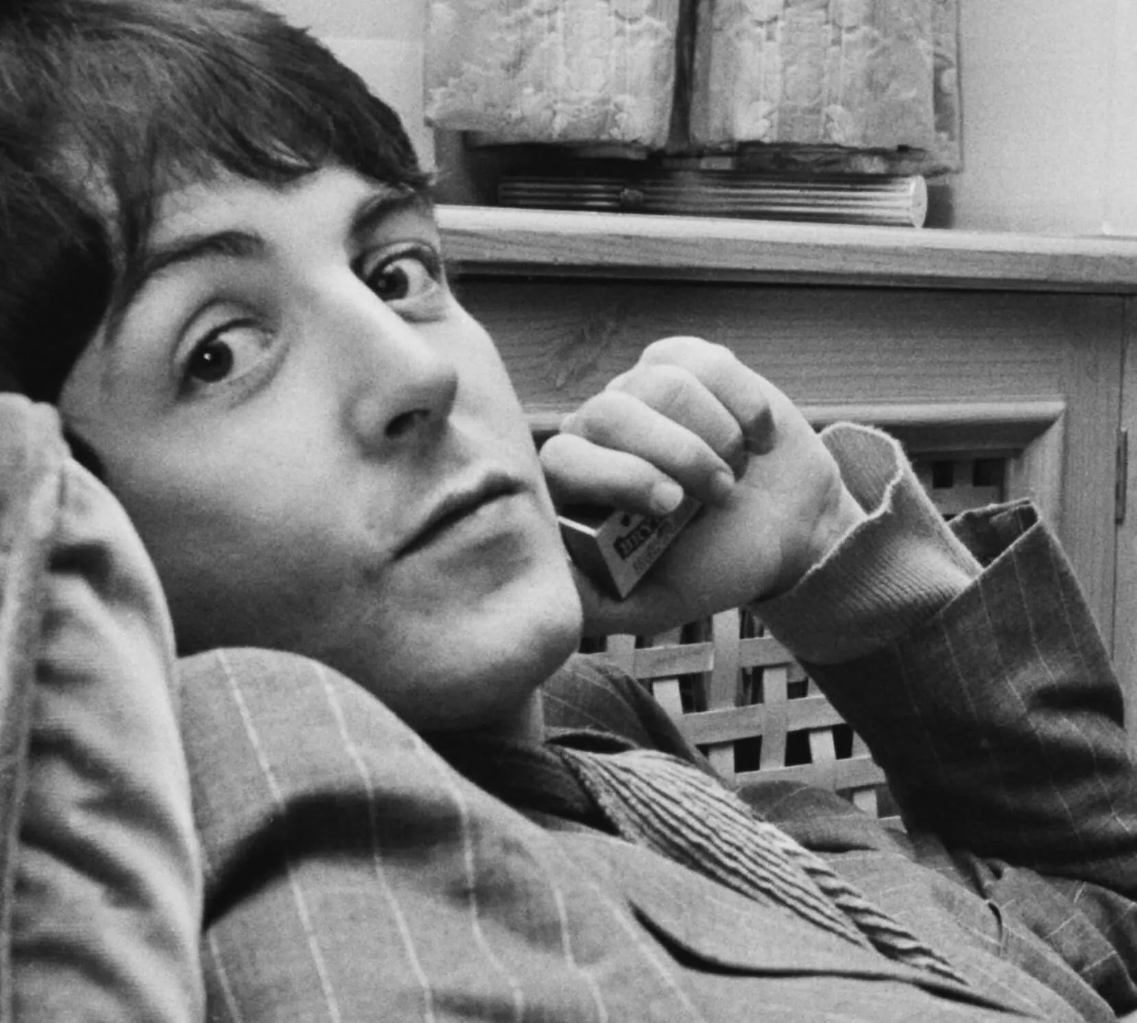 The Beatles' Paul McCartney leaning back