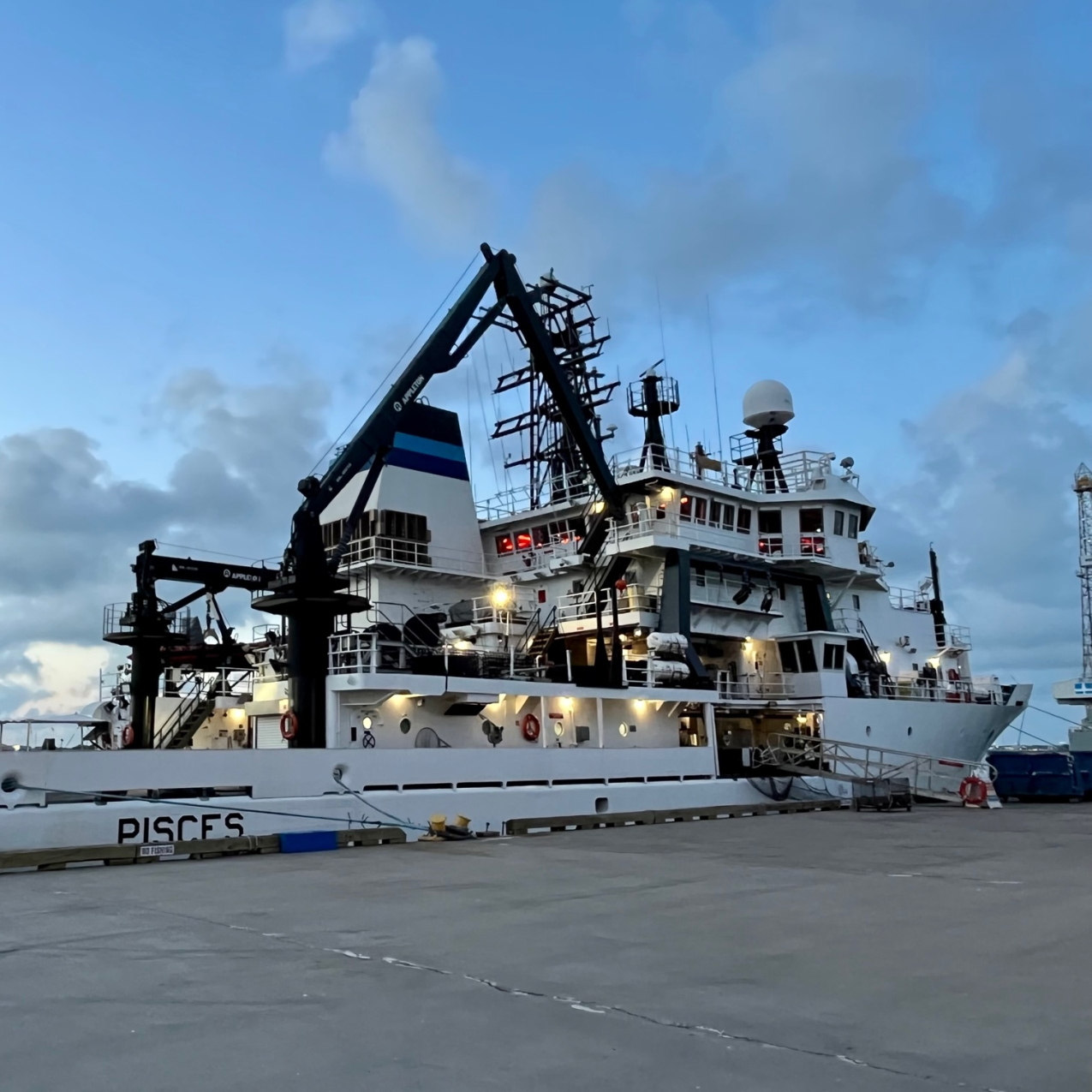  A side view of NOAA Ship Pisces at port. 